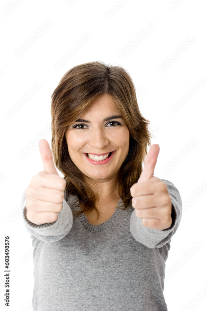 Portrait of an attractive young woman with thumbs up. - Isolated on white Portrait of an attractive young woman with thumbs up. - Isolated on white