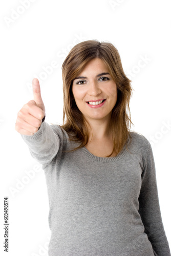 Portrait of an attractive young woman with thumbs up. - Isolated on white © Designpics