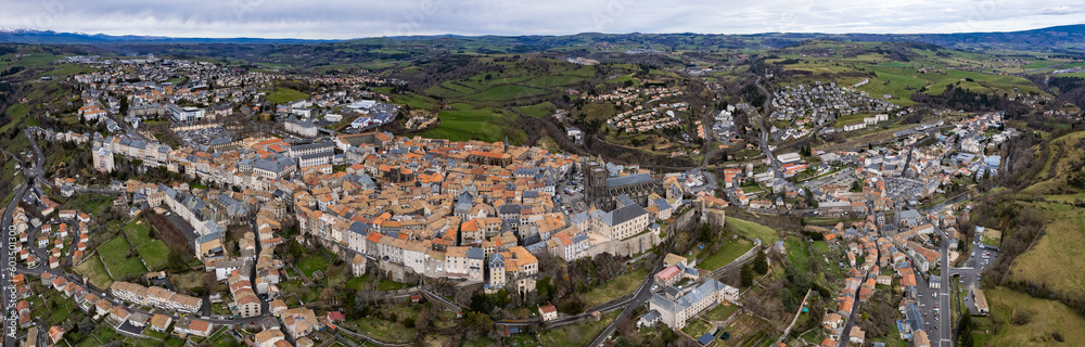 Aerial around the city Saint-Flour on a sunny day in early spring.