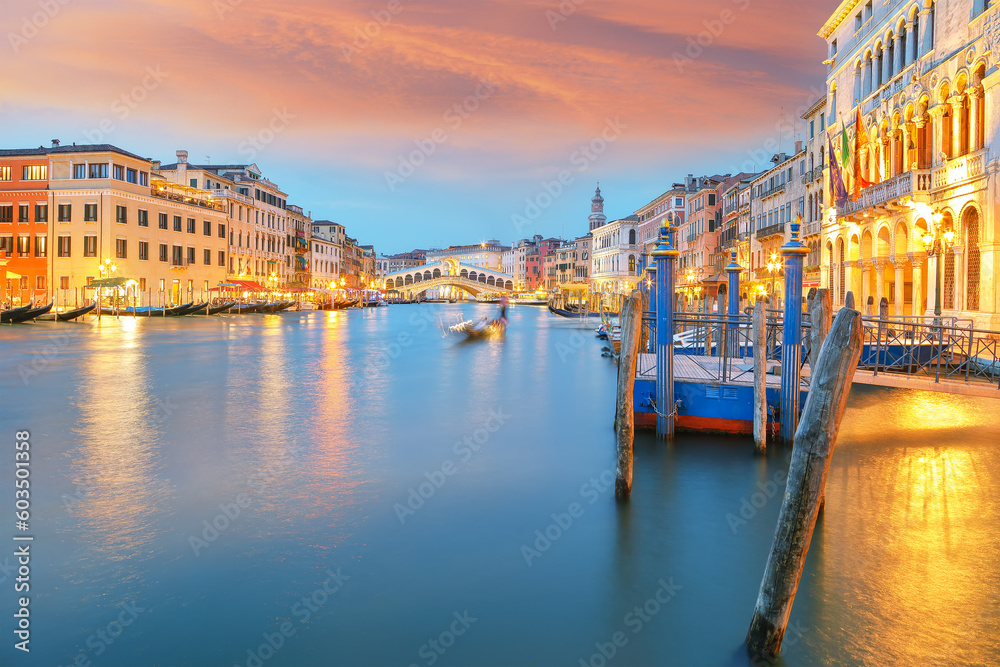 Amazing sunset and evening cityscape of Venice with famous Canal Grande and Rialto Bridge