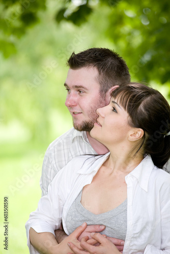 happy young couple relaxing in park