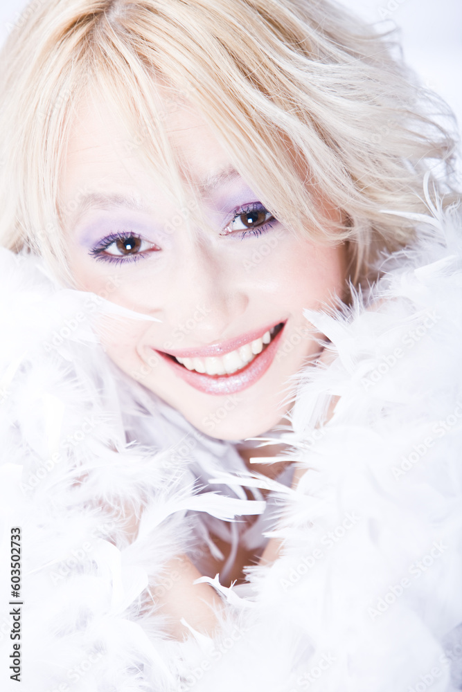 beautiful smiling young woman with white boa
