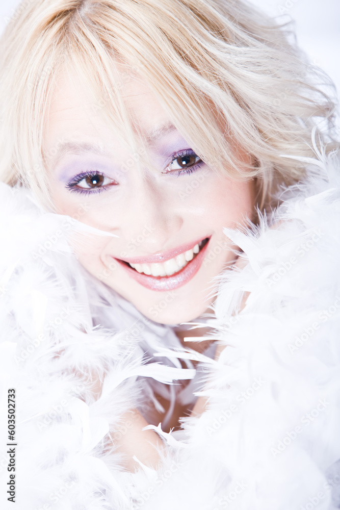 beautiful smiling young woman with white boa beautiful smiling young woman with white boa