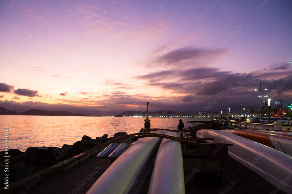 Φωτογραφία Sunset at Ponta da Praia, in Santos, with Hawaiian canoes in the foreground
