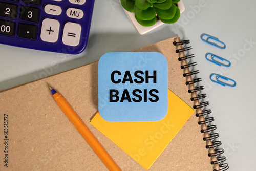 Cash Basis is shown using a text and photo of calculator