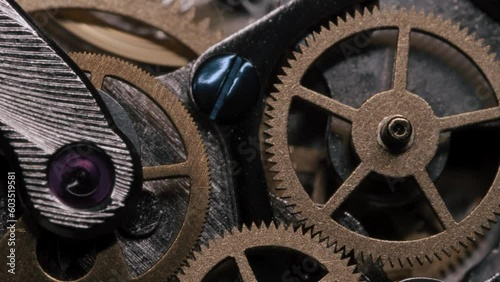 Closeup of turning gears in a mechanical wristwatch - 4K