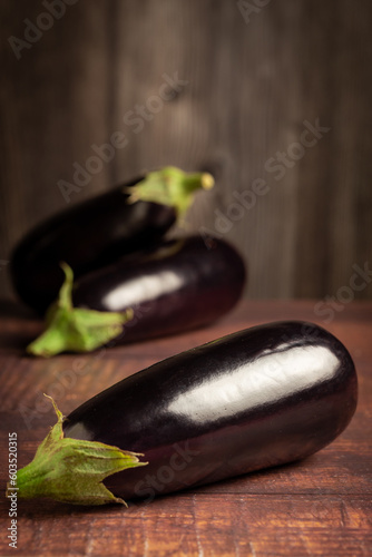 Fresh eggplants on the table.