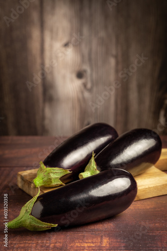 Fresh eggplants on the table.