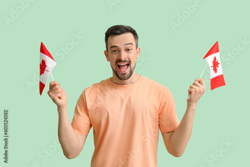 Handsome man with flags of ...