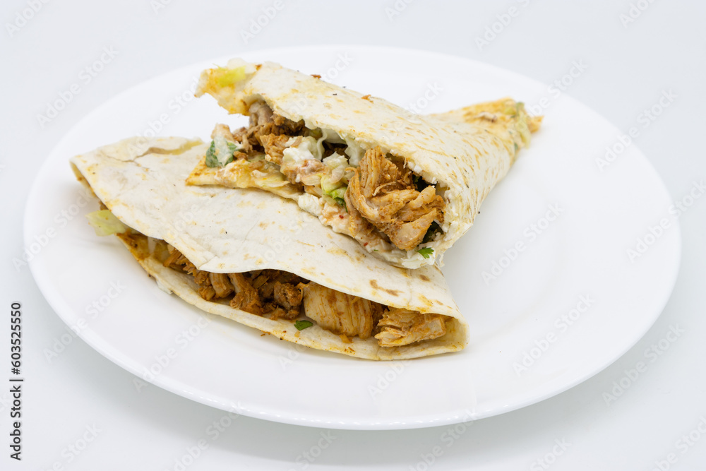 Two Chicken Quesadillas on a White Plate