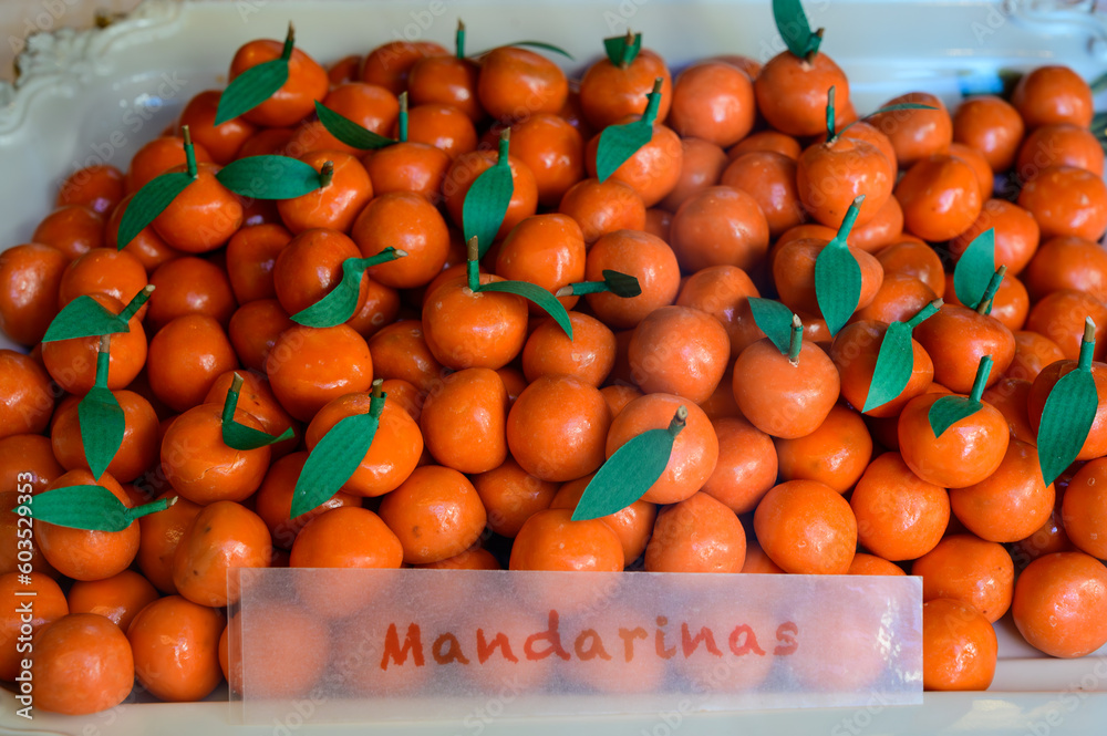 Sweet fruit candy beads in artisan Spanish confectionery shop, english translation: mandarins