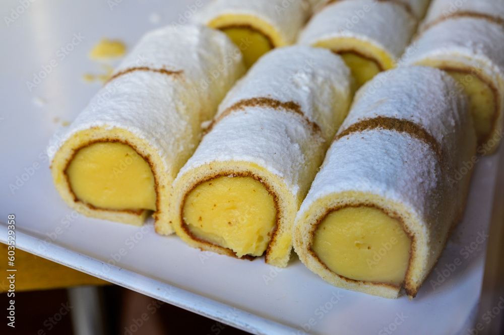 Fresh baked pastries and sweets on display in artisan Spanish confectionery shop