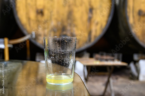 Tasting of traditional natural Asturian cider made from  fermented apples in barrels for several months should be poured from great height  allowing lots of air bubbles into the drink.