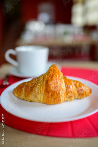 Fresh baked buttered croissants served in restaurant for continental or French breakfast