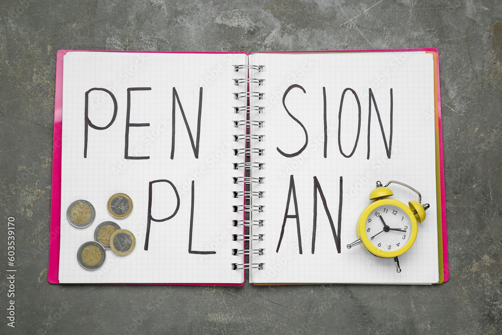 Notebook with words Pension Plan, coins and yellow small alarm clock on grey table, top view Notebook with words Pension Plan, coins and yellow small alarm clock on grey table, top view