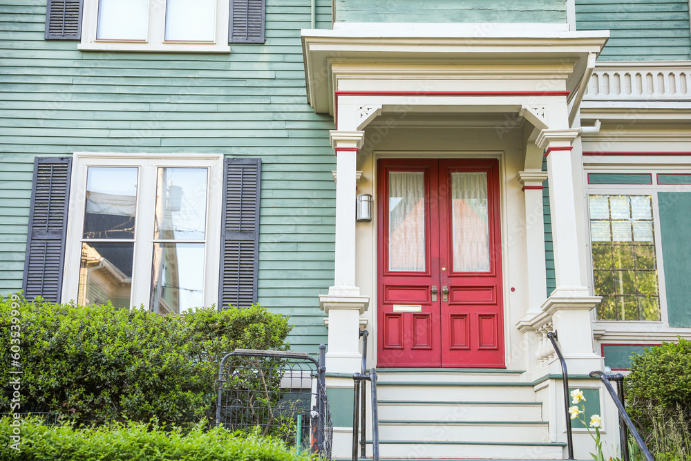 American house suburbs front entrance townhomes symbolize desirable living, investment, and the real estate market. They represent the allure of homeownership and the dynamics of buying and selling pr