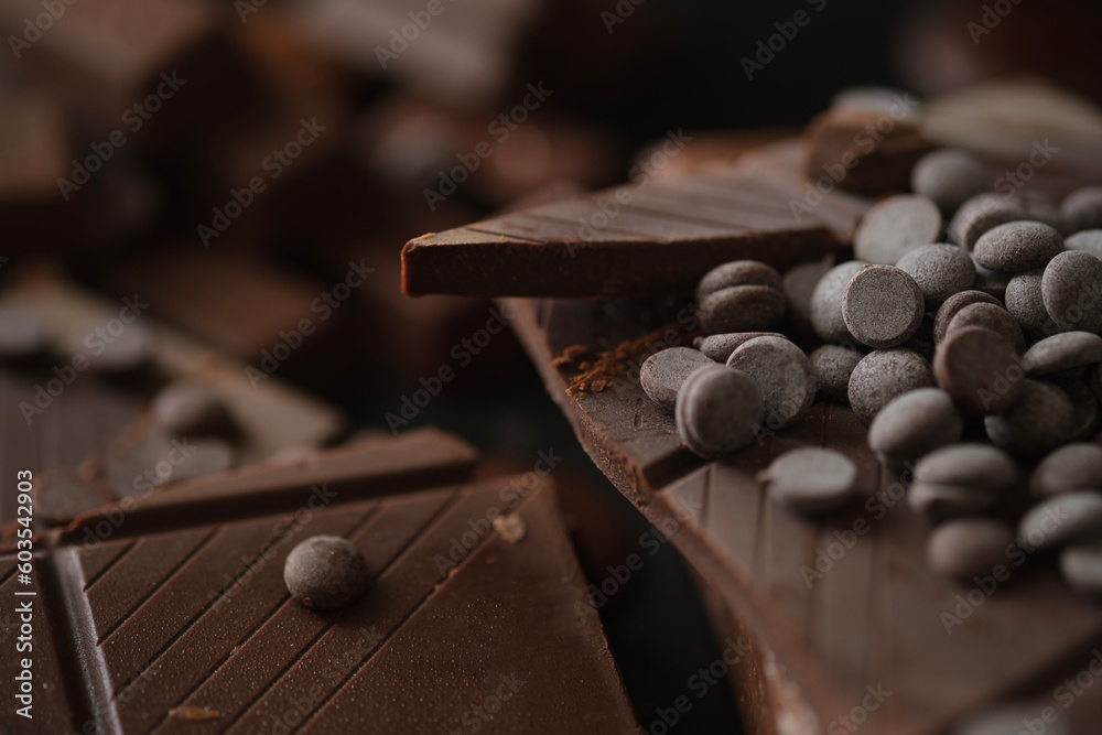 Closeup view of pieces of chocolate bar with chocolate chips.