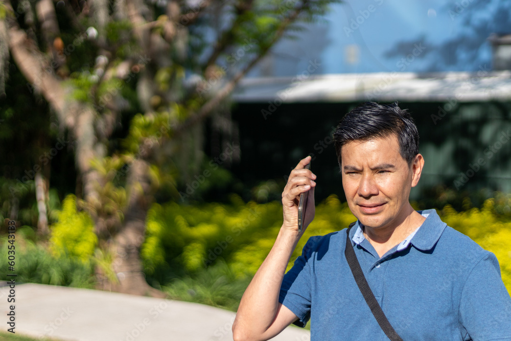 man talking on cell phone man talking on cell phone