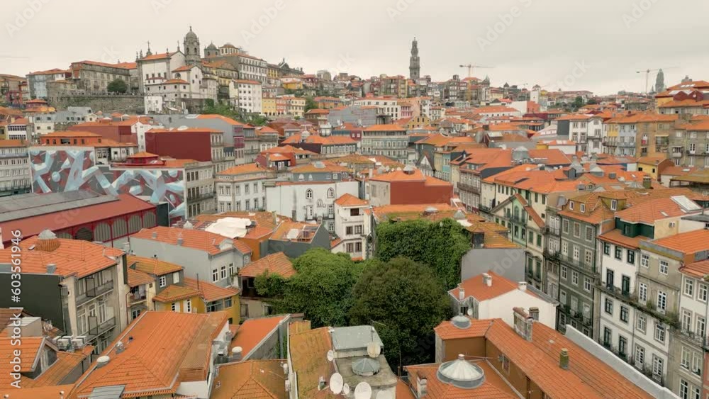 Low aerial dolly shot over colourful houses on the Douro waterfront in Porto Low aerial dolly shot over colourful houses on the Douro waterfront in Porto