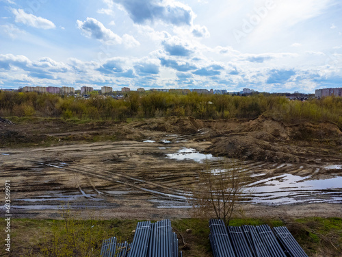 Obraz na płótnie Aerial view landscape. View of overcast sky, mud and puddles. w salonie