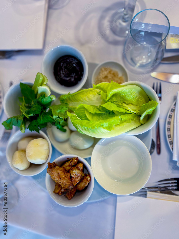 The main meal on Pesach is the Passover evening, or seder. the main dish is a plate for the seder. in Hebrew - keara. There are 6 products on it - an egg and a chicken wing, greens, water, etc. The main meal on Pesach is the Passover evening, or seder. the main dish is a plate for the seder. in Hebrew - keara. There are 6 products on it - an egg and a chicken wing, greens, water, etc.