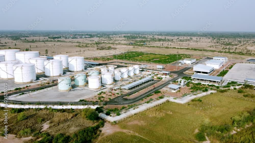 Aerial drone view of petroleum products storage terminal. Factory of the petrochemical energy industry. Oil tank for business company transport of benzine and diesel power. Aerial drone view of petroleum products storage terminal. Factory of the petrochemical energy industry. Oil tank for business company transport of benzine and diesel power.