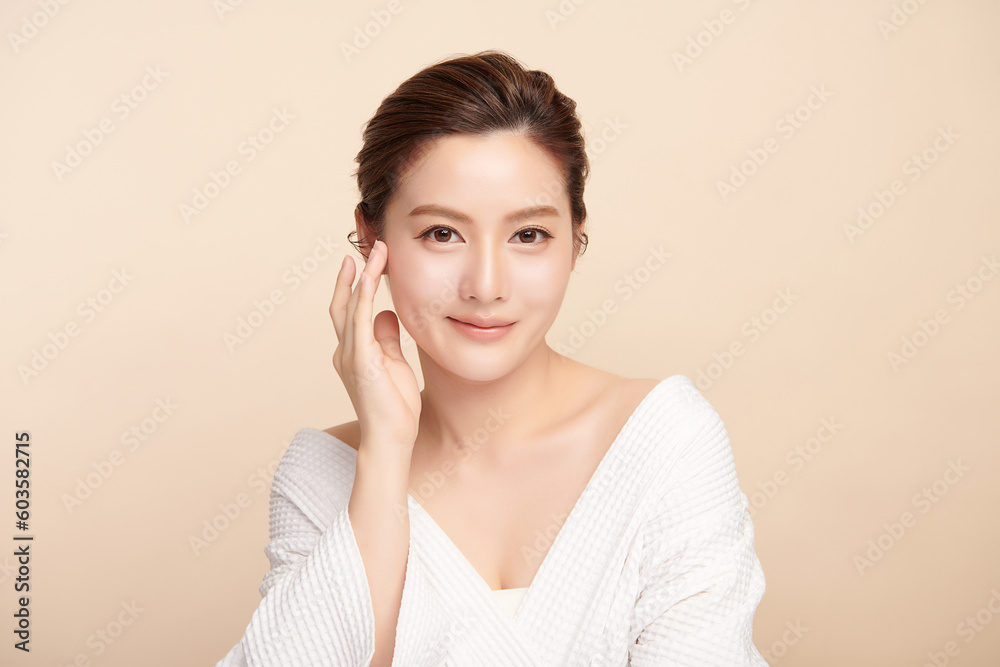 Beautiful young asian woman with clean fresh skin on beige background, Face care, Facial treatment, Cosmetology, beauty and spa, Asian women portrait. Beautiful young asian woman with clean fresh skin on beige background, Face care, Facial treatment, Cosmetology, beauty and spa, Asian women portrait.
