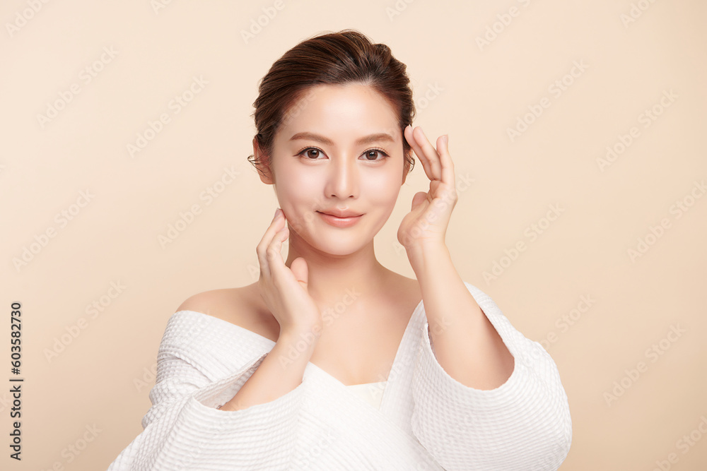 Beautiful young asian woman with clean fresh skin on beige background, Face care, Facial treatment, Cosmetology, beauty and spa, Asian women portrait. Beautiful young asian woman with clean fresh skin on beige background, Face care, Facial treatment, Cosmetology, beauty and spa, Asian women portrait.