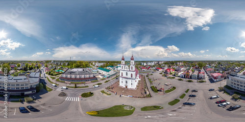 aerial full hdri 360 panorama view over square of historical center with white baroque catholic church in equirectangular projection with zenith and nadir. VR AR content