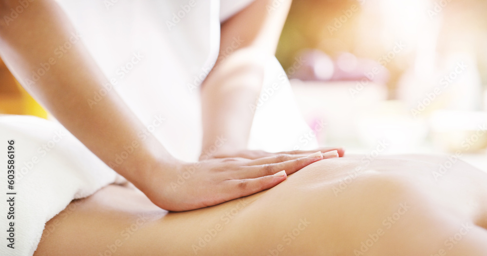 Fototapeta premium Woman, hands and back massage at spa in relax for zen, physical therapy or treatment at the resort. Hand of masseuse giving female a relaxing body rub for muscle relief, peace or wellness at a salon
