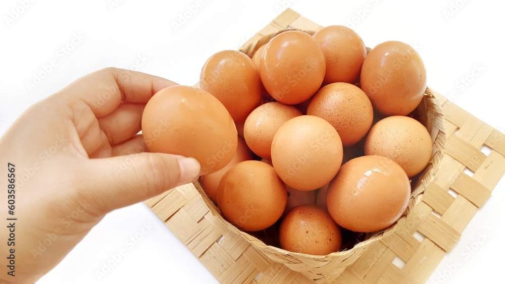Eggs chicken fresh in wooden basket isolated on white background Eggs chicken fresh in wooden basket isolated on white background
