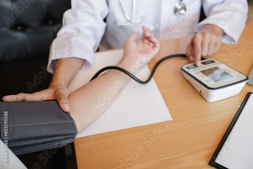 Doctor checking  patient arterial blood pressure. Health care