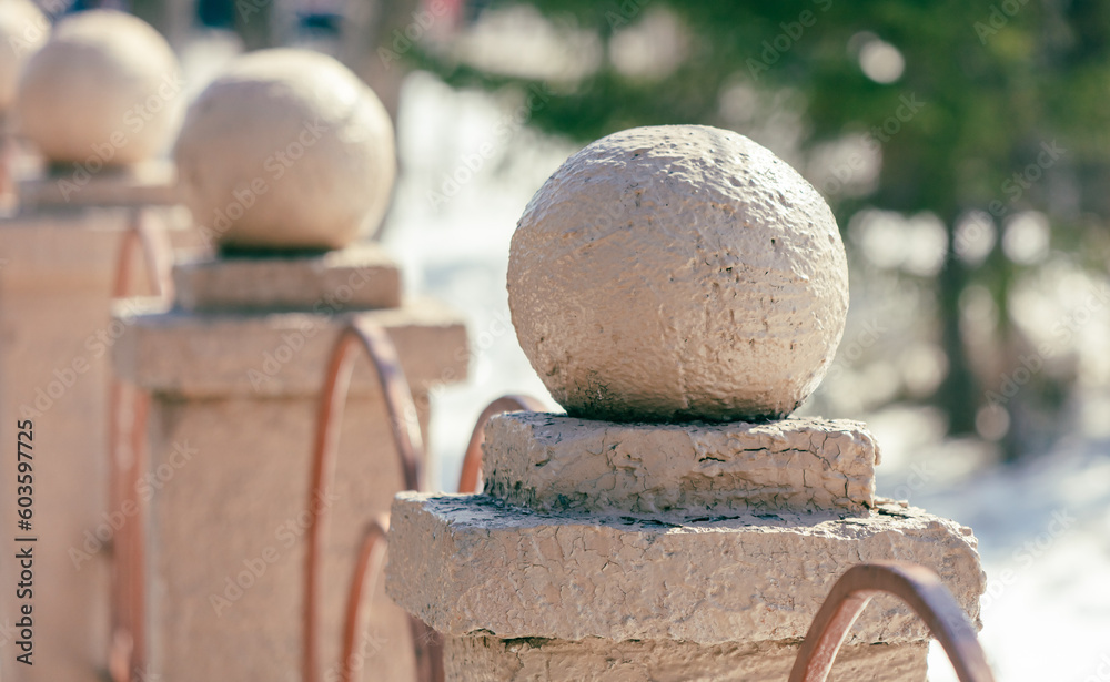 Fototapeta premium Stone balustrade in the city park. Selective focus