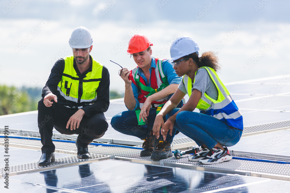 Technician engineer service meeting and checking solar cell on rooftop of industrial factory. Inspection worker repair solar cell panels. Clean Renewable energy, Ecology and alternative power concept Technician engineer service meeting and checking solar cell on rooftop of industrial factory. Inspection worker repair solar cell panels. Clean Renewable energy, Ecology and alternative power concept