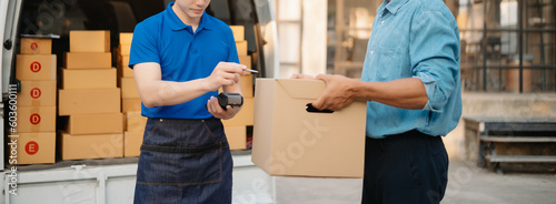 Fotografi Delivery man by sending box of parcel to customers service at home as having corona virus disease and shipping concept