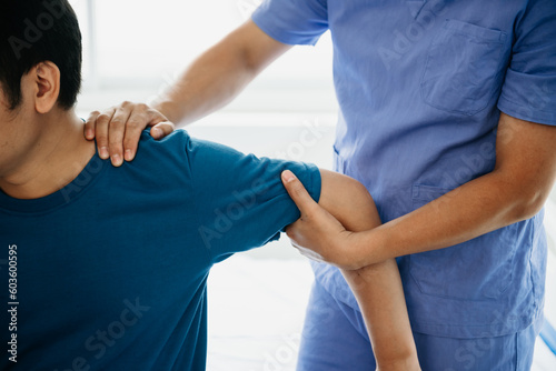 Doctor consulting with patient Back problems Physical on the bed in clinic concept .