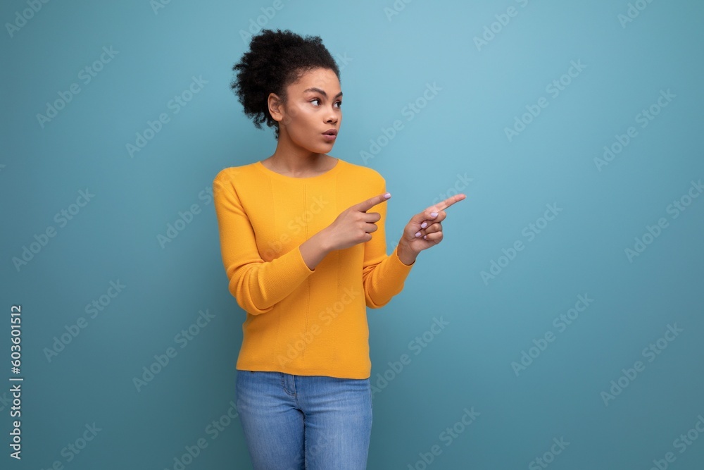 young brunette latin female adult in yellow blouse looks away young brunette latin female adult in yellow blouse looks away