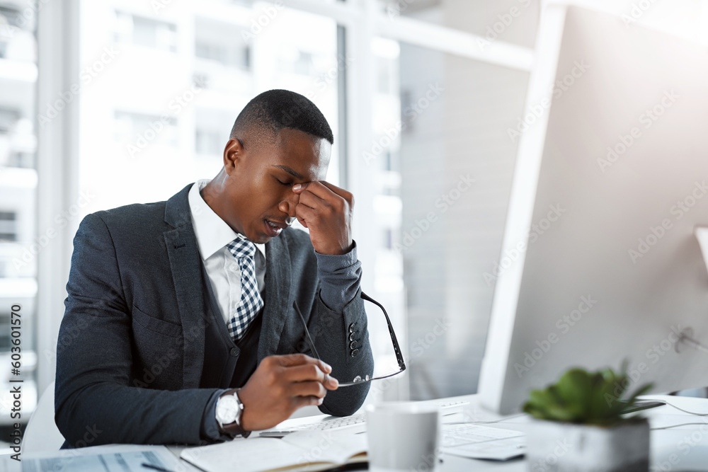 Black man in business, headache and stress with burnout, depression and brain fog in office. Male person with pain at desk, migraine and tired, overworked with work crisis anxiety in the workplace Black man in business, headache and stress with burnout, depression and brain fog in office. Male person with pain at desk, migraine and tired, overworked with work crisis anxiety in the workplace