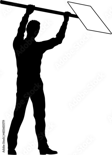 Protestor or demonstrator at a demonstration march, picket line or strike protest rally in silhouette. Holding up a banner or picket sign board placard.