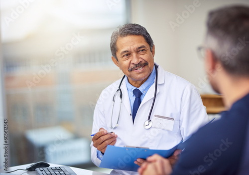 Healthcare, discussion and doctor with a patient for a consultation in the office in clinic. Professional, conversation and mature male medical worker talking to man on diagnosis in medicare hospital