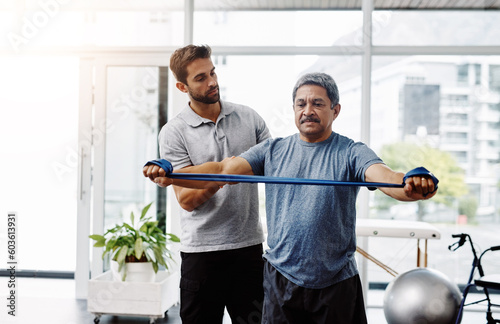 Physiotherapy, rehabilitation and band with old man and doctor for training, stretching and injury. Medical, healing and healthcare with physiotherapist and patient for consulting, help and fitness