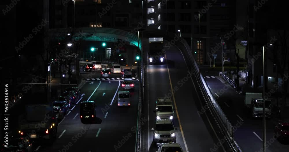 A night cityscape of the traffic jam at the urban city street telephoto shot A night cityscape of the traffic jam at the urban city street telephoto shot