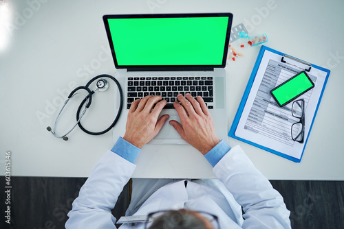 Laptop, green screen and doctor hands with medicine, documents or healthcare service, research and mockup above. Space, telehealth and pills with medical person typing, phone mock up and computer app