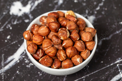 Hazelnut. Peeled hazelnuts in ceramic bowl. Superfood. Vegetarian Food concept. Healthy snacks. Close up
