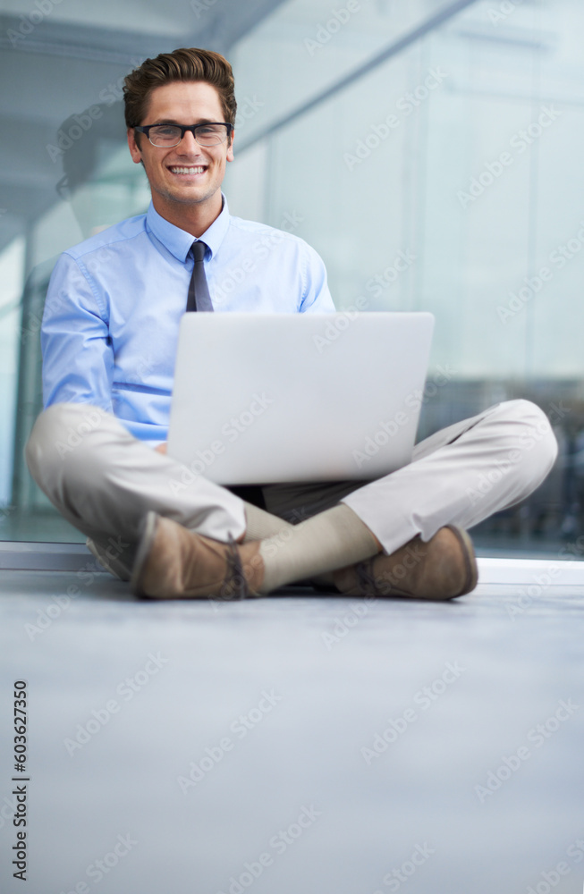 Laptop, office floor and portrait of happy man, agent or professional consultant typing report, project or email. Research, company workplace and male businessman, banker or person sitting on ground Laptop, office floor and portrait of happy man, agent or professional consultant typing report, project or email. Research, company workplace and male businessman, banker or person sitting on ground