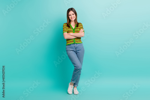 Full length photo of stunning pretty lady wear stylish clothes arm crossed presenting collection outfit isolated on cyan color background