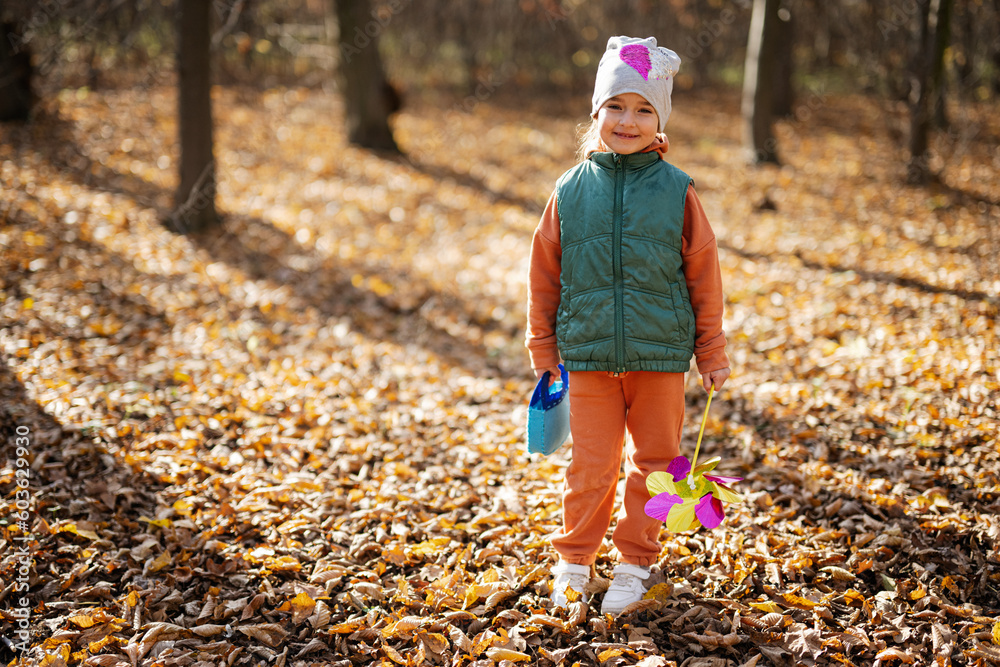 Autumn outdoor portrait of beautiful happy child girl in forest. Autumn outdoor portrait of beautiful happy child girl in forest.