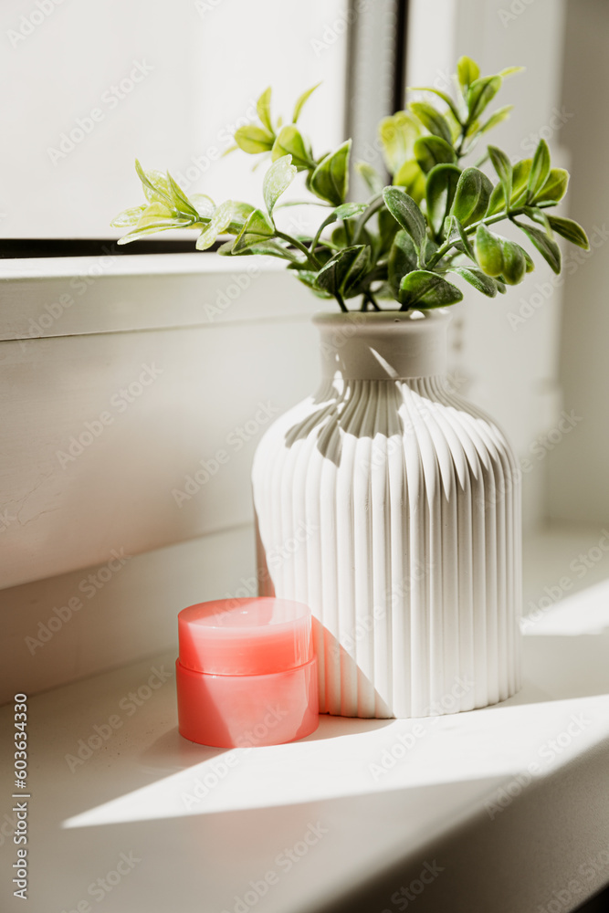 Gypsum vase, handmade by the window with flowers. Cosmetics, lip balm for store content. Mini vase for dried flowers and natural flowers.