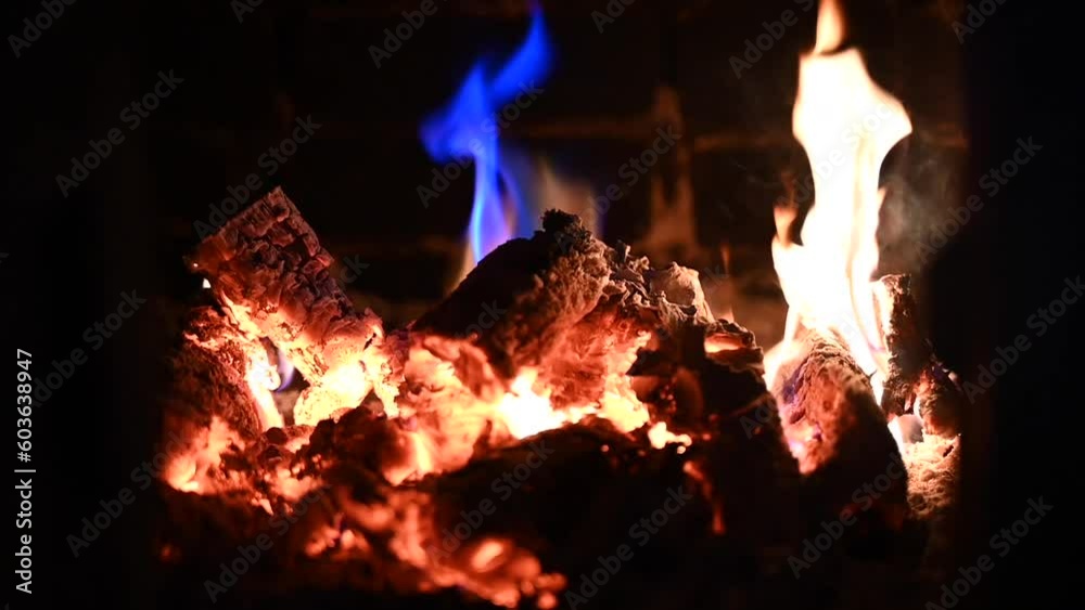 Orange and blue flame in wood burning stove