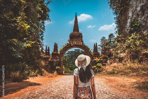 Traveler asian woman relax and travel in temple at Khao Na Nai Luang Dharma Park Surat Thani Thailand photo